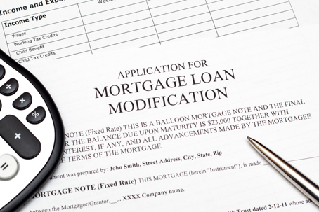 Mortgage loan modification application document on desk