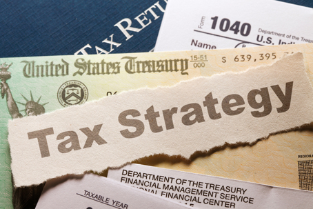 Tax documents and IRS forms illustrating tax debt concerns.